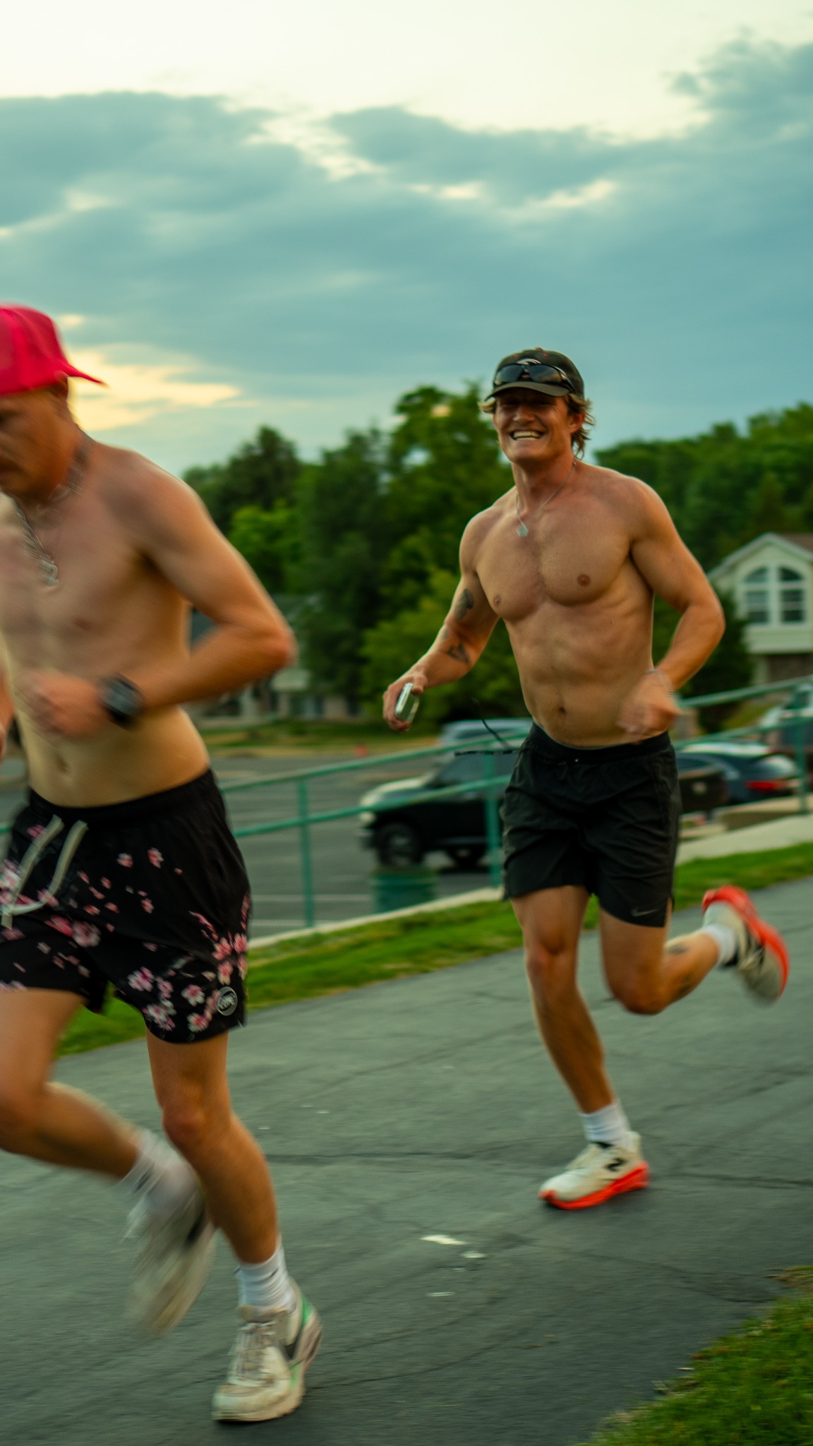 Two athletes running together during an outdoor endurance event